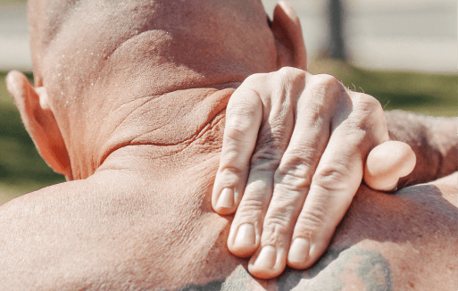 Prather-Subluxation 3 Shirtless person reaching over their shoulder to rub their trapezius.