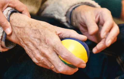 Prather-Numbness & Tingling 1 An older person's hands holding a lacrosse ball.