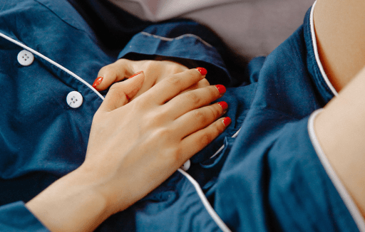 Prather-Heartburn & Digestive Health 2 Person lying down and holding their stomach.